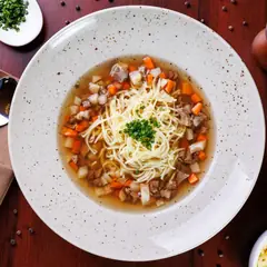 Beef broth with noodles and vegetables