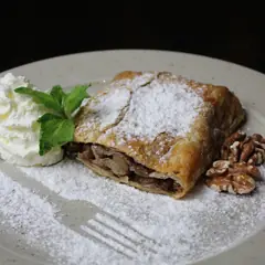 Apple strudel with whipped cream