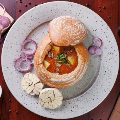 Goulash soup in a bread bowl