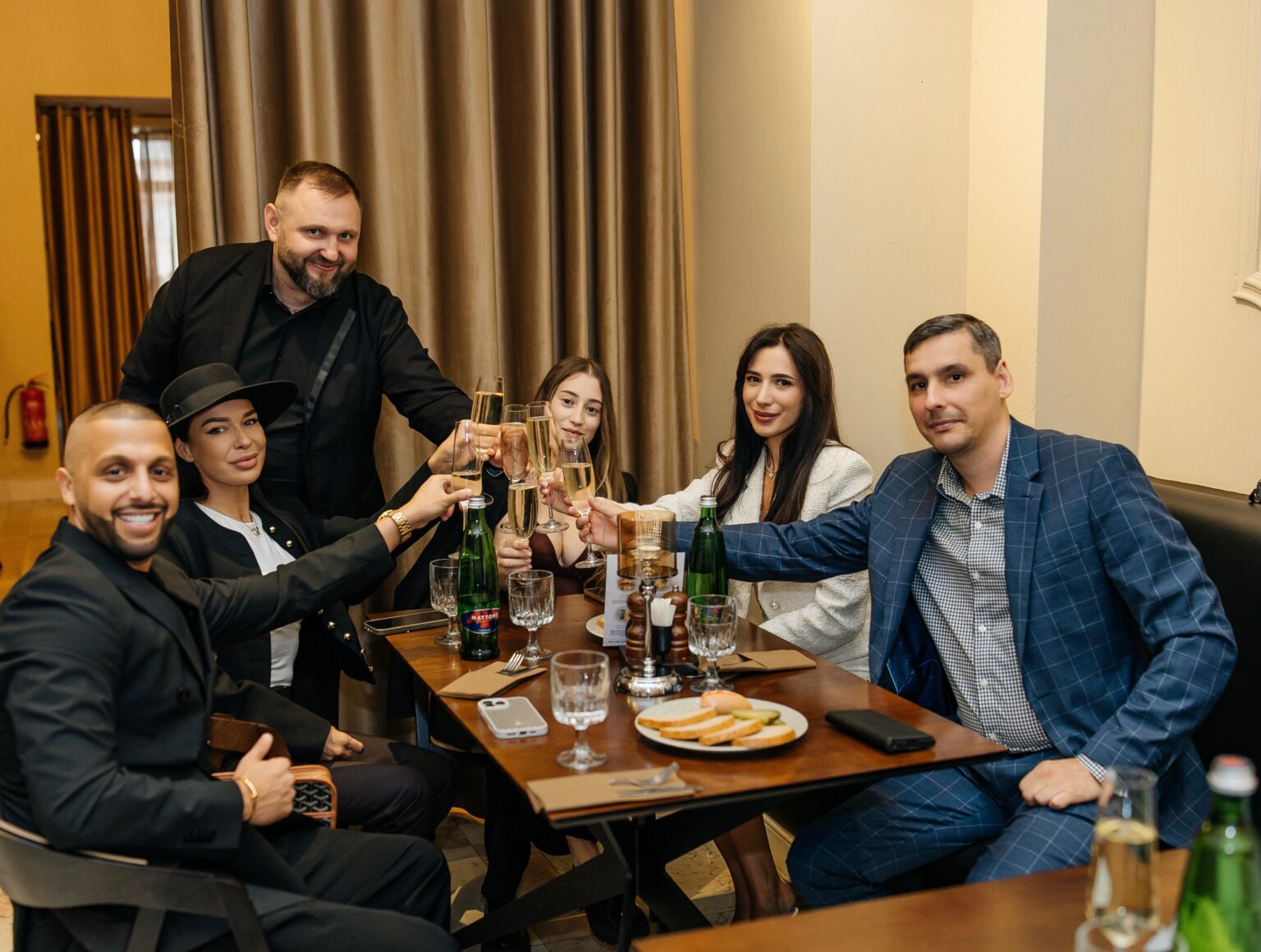 Guests raising their glasses of champagne at the official opening of the A. Dvořák brewery restaurant and museum in Prague.