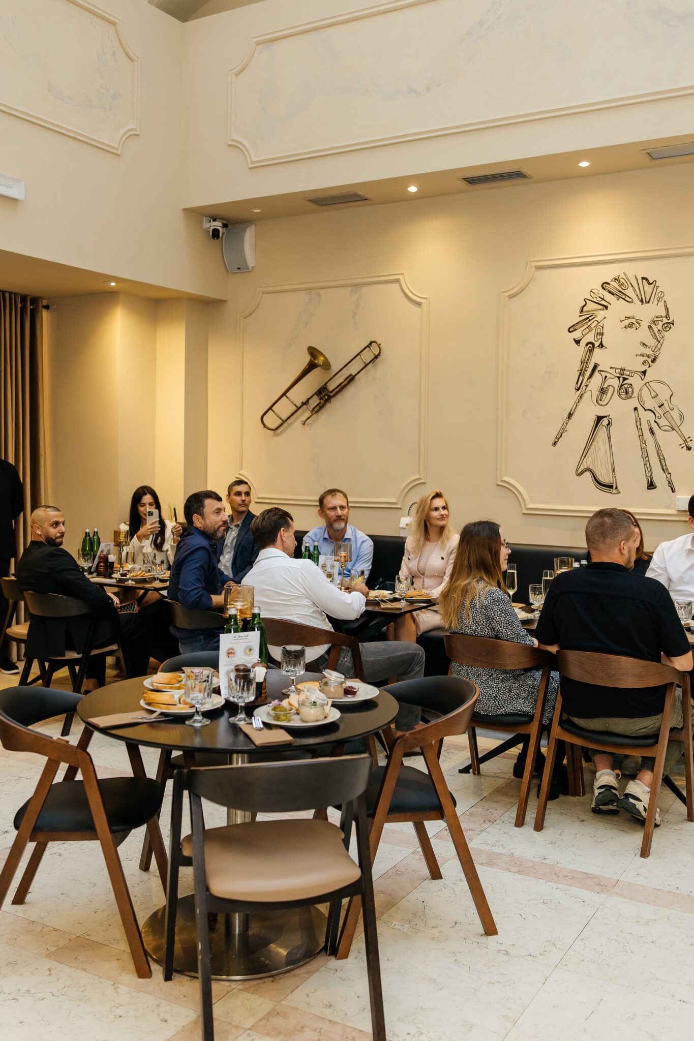Guests watching the music programme during the grand opening of the A. Dvořák brewery restaurant in Prague.