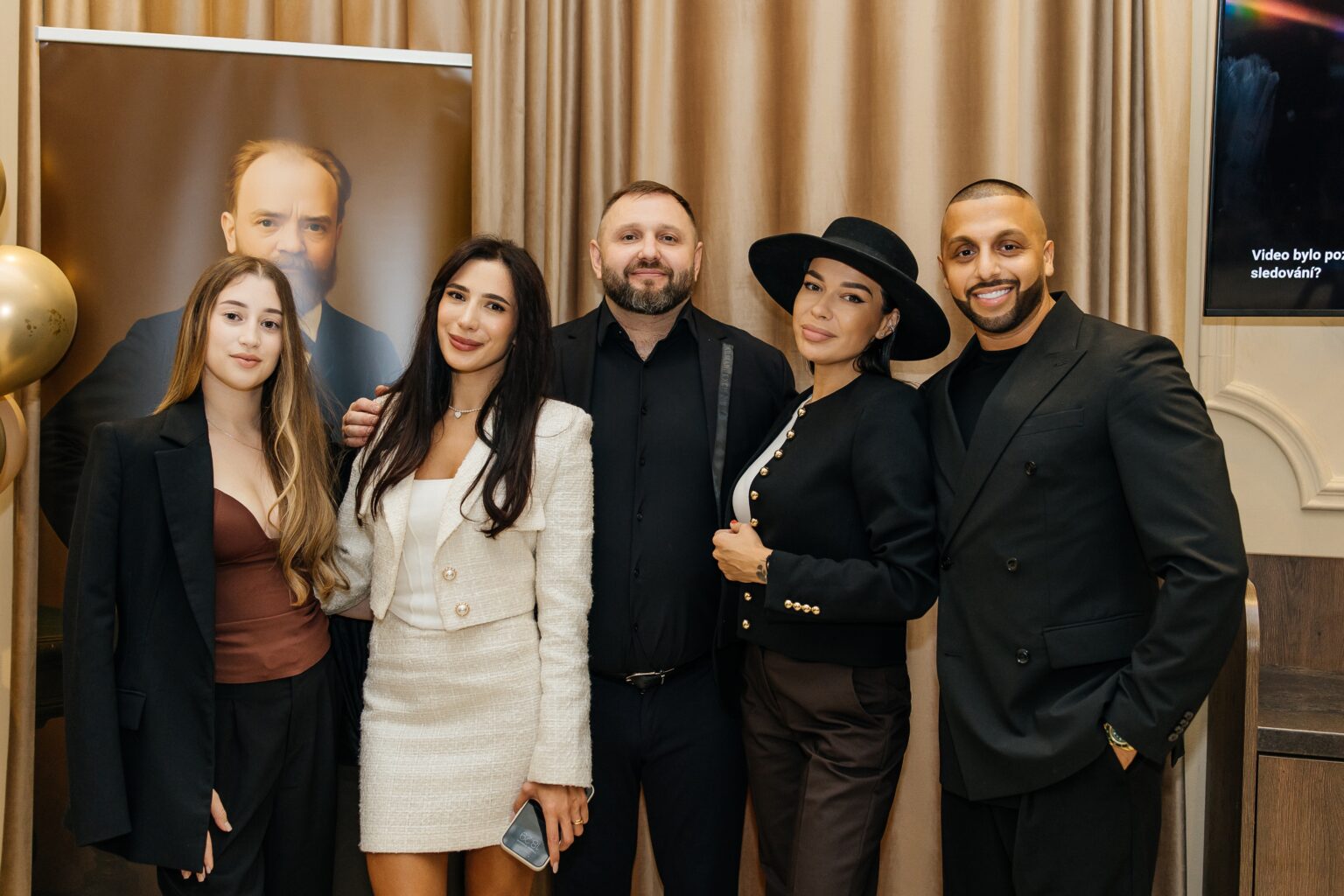 Guests at the official opening of the A. Dvořák brewery restaurant and museum in Prague – a group photo in front of the portrait of the composer Antonín Dvořák.