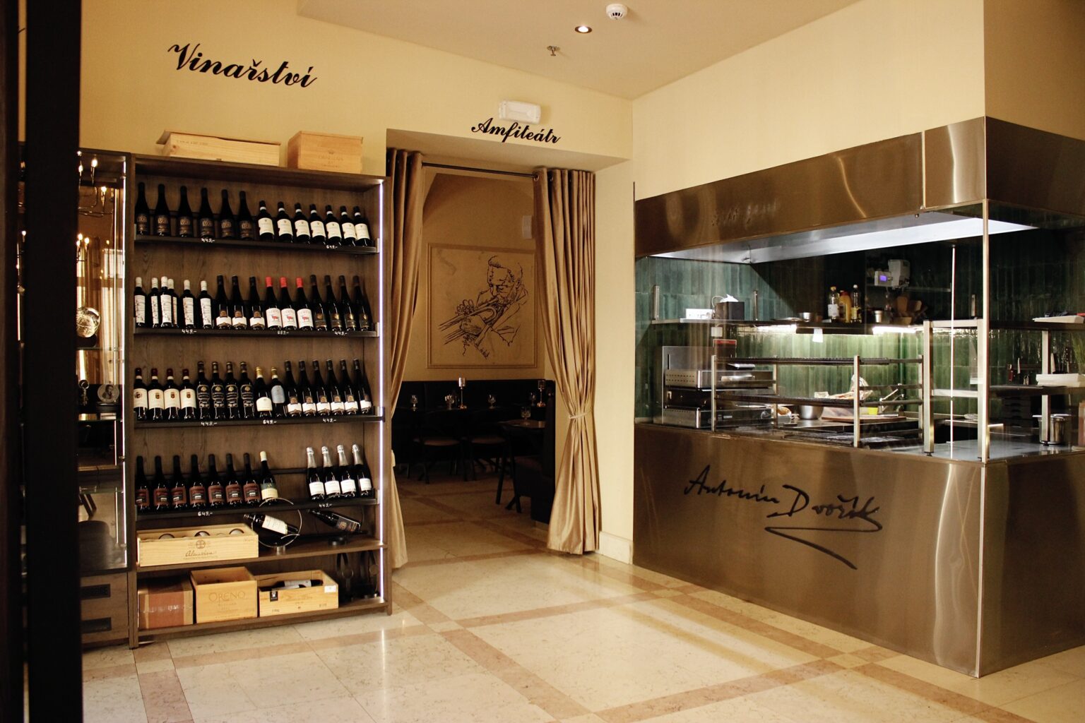 The open grill and wine bar at the A. Dvořák restaurant, where guests can watch their food being prepared and enjoy the authentic atmosphere.